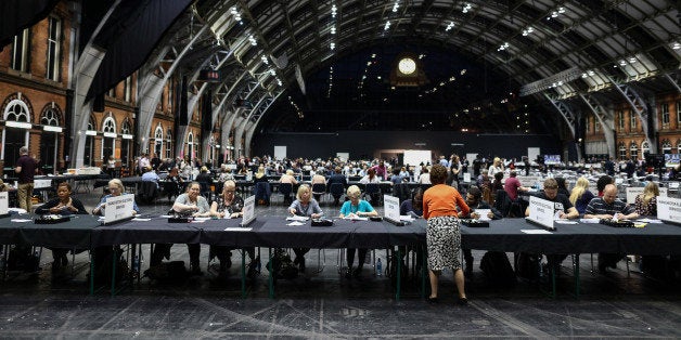 Tellers count ballot papers for the European Union (EU) referendum at Manchester Central Convention Complex in Manchester, U.K., on Thursday, June 23, 2016. Early results in the U.K. referendum over Britain's membership of the European Union suggested a closer race than initial opinion polls implied. Photographer: Simon Dawson/Bloomberg via Getty Images