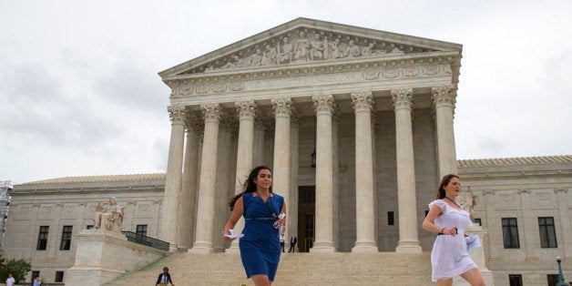 Members of the media run out of the Supreme Court in Washington, Thursday, June 23, 2016, to deliver court decisions. (AP Ph
