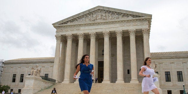 Members of the media run out of the Supreme Court in Washington, Thursday, June 23, 2016, to deliver court decisions. (AP Photo/Evan Vucci)