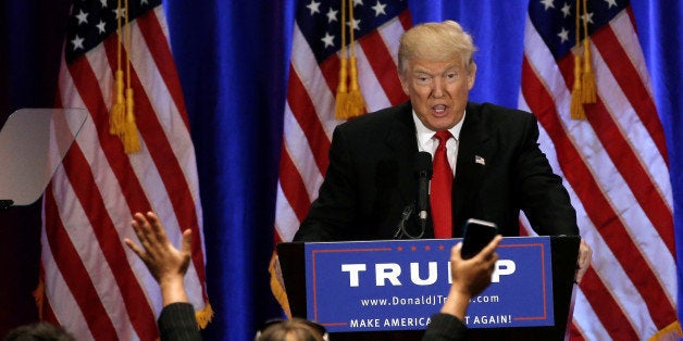 Republican presidential candidate Donald Trump is cheered by supporters as he delivers a speech at the Trump Soho Hotel in Ma