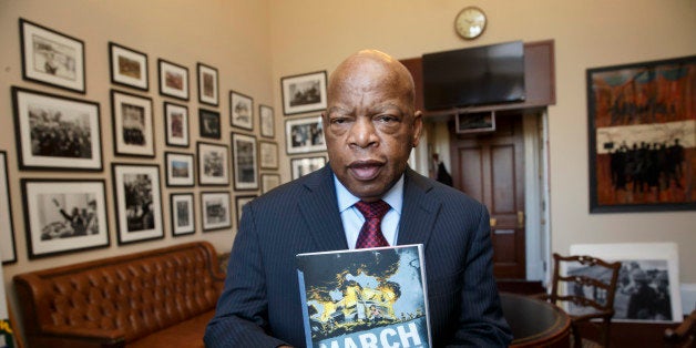 In this photo taken Jan. 15, 2015, Rep. John Lewis, D-Ga., holds the new installment of his award-winning graphic novel on ci
