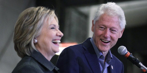 AMES, IA - NOVEMBER 15: Democratic presidential candidate Hillary Clinton (L) and her husband and former President Bill Clinton share a moment on stage during the Central Iowa Democrats fall barbecue November 15, 2015 at Hansen Agriculture Student Learning Center of Iowa State University in Ames, Iowa. Clinton continued to campaign for the nomination from the Democratic Party. (Photo by Alex Wong/Getty Images)