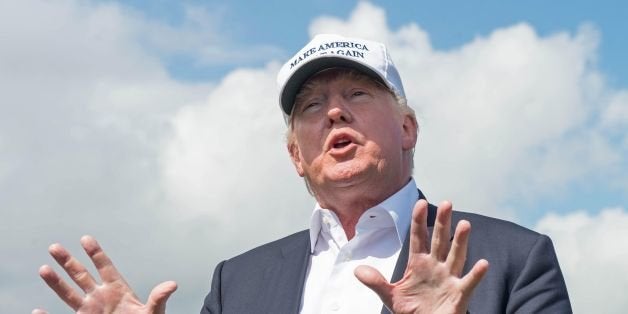 Presumptive Republican presidential nominee Donald Trump speaks to members of the media during a tour of his International Go