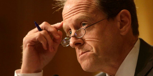 Senator Pat Toomey (R-PA) questions witnesses at the Senate Finance Committee in Washington May 21, 2013. A Senate panel will try on Tuesday to pry more details out of current and former officials of the Internal Revenue Service about the agency's targeting of conservative groups for extra scrutiny when they sought tax-exempt status. REUTERS/Gary Cameron (UNITED STATES - Tags: POLITICS BUSINESS)