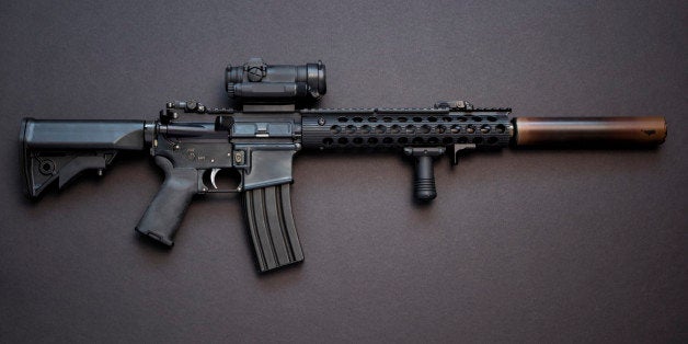 Assault rifle in caliber .223 with high capacity magazine and silencer.