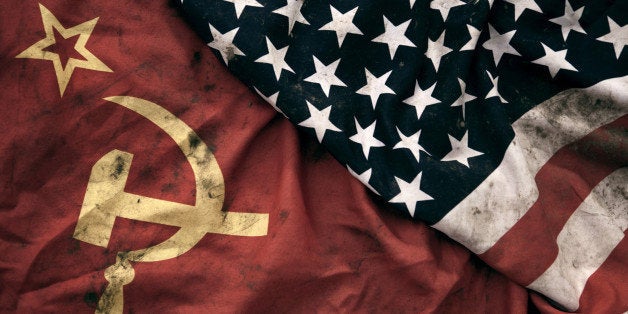 Low key photography of grungy old Soviet Union and United States of America flags. USSR, CCCP, USA.