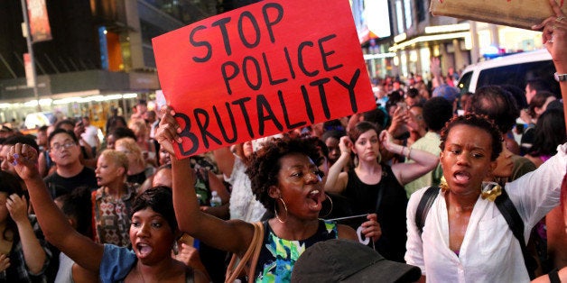 NEW YORK, NY - JULY 07: Activists protest in Times Square in response to the recent fatal shootings of two black men by police, July 7, 2016 in New York City. Protests and public outcry have grown in the days following the deaths of Alton Sterling on July 5, 2016 in Baton Rouge, Louisiana and Philando Castile on July 6, 2016, in Falcon Heights, Minnesota. (Photo by Yana Paskova/Getty Images)