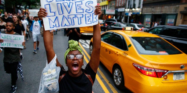 NEW YORK, NY - JULY 8: People take part in a protest on July 8, 2016 in New York City. Police presence was increased around New York City after five police officers were killed in a shooting in Dallas. (Photo by Kena Betancur/Getty Images)