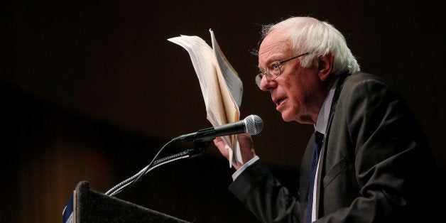 U.S. Democratic presidential candidate and U.S. Senator Bernie Sanders holds up his notes while speaking about his attempts t