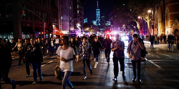 Protesters shout slogans against the law as they march on the street during a rally in New York, November 24, 2014, after the