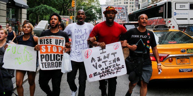 People take part in a protest against the killings of Alton Sterling and Philando Castile during a march in New York July 7, 2016. REUTERS/Eduardo Munoz