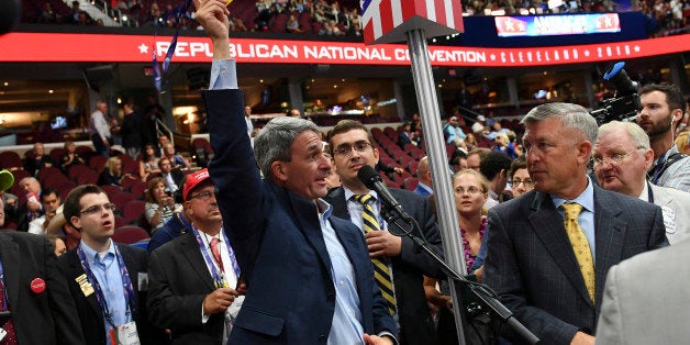 CLEVELAND, OH - JULY 18: Former Virginia Attorney General and current Delegate, Ken Cuccinelli, center, removes his credentials and threatens to leave while demanding a roll call vote on the convention rules during the Republican National Convention on July 18, 2016 in Cleveland, Ohio. (Photo by Ricky Carioti/The Washington Post via Getty Images)