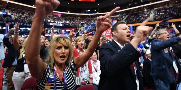 Delegates cheer on day three of the Republican National Convention at the Quicken Loans Arena in Cleveland, Ohio, on July 20, 2016. / AFP / JIM WATSON (Photo credit should read JIM WATSON/AFP/Getty Images)