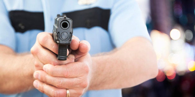 USA, Illinois, Metamora, Close-up of police officer holding handgun