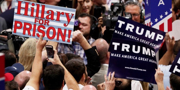 CLEVELAND, OH - JULY 19: Delegates hold signs in support of presumptive Republican presidential candidate Donald Trump durin