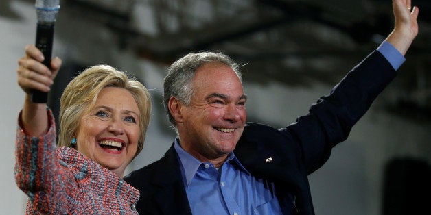 Democratic U.S. presidential candidate Hillary Clinton and U.S. Senator Tim Kaine (D-VA) wave to the crowd during a campaign