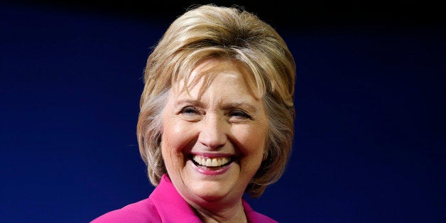 Democratic U.S. presidential candidate Hillary Clinton smiles during a campaign rally, where she received the endorsement of U.S. President Barack Obama, in Charlotte, North Carolina, U.S., July 5, 2016. REUTERS/Jonathan Ernst