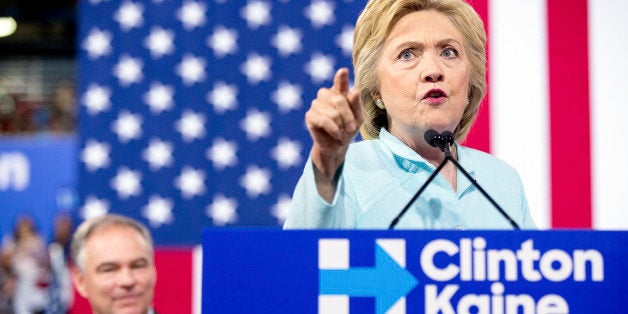 Democratic presidential candidate Hillary Clinton accompanied by Sen. Tim Kaine, D-Va., speaks at a rally at Florida International University Panther Arena in Miami, Saturday, July 23, 2016. Clinton has chosen Kaine to be her running mate. (AP Photo/Andrew Harnik)