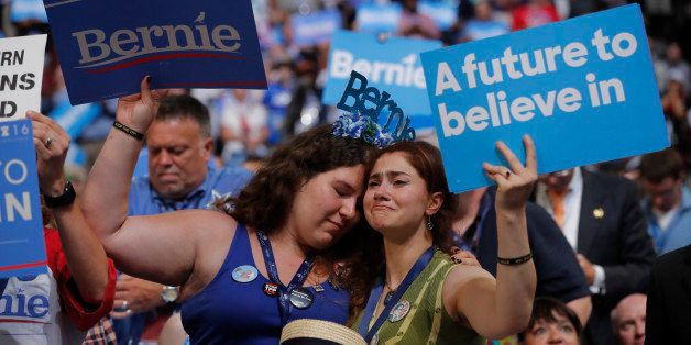 Emotional supporters of former Democratic U.S. presidential candidate Senator Bernie Sanders listen as he speaks during the first session at the Democratic National Convention in Philadelphia, Pennsylvania, U.S., July 25, 2016. REUTERS/Jim Young