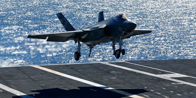 U.S Navy test Pilot Tony Wilson makes the first ever landing of the F-35C Joint Strike Fighter on an aircraft carrier using its tailhook system, off the coast of California November 3, 2014. Two Lockheed Martin Corp F-35C fighter jets landed successfully on the USS Nimitz off the coast of San Diego on Monday, marking the new warplane's first landing on an aircraft carrier using its tailhook system. REUTERS/Mike Blake (UNITED STATES - Tags: TRANSPORT MILITARY)