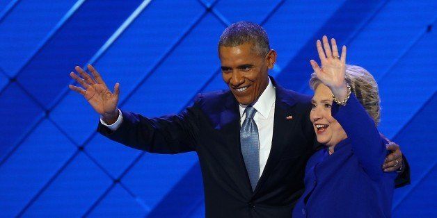 PHILADELPHIA, USA - JULY 28: U.S. President Barack Obama (L) and the nominee of the Democratic Party for President of the United States Hillary Clinton (R) wave to Democratic Party supporters at congress hall ahead of 58th Presidential election on November 08, at Democratic Party Congress in Philadelphia, USA on July 28, 2016. Hillary Clinton is the first female Presidential nominee in U.S. history. (Photo by Volkan Furuncu/Anadolu Agency/Getty Images)