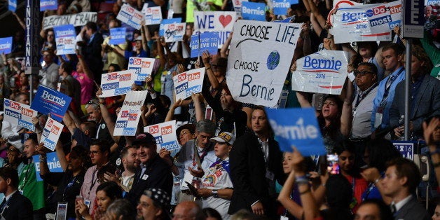 PHILADELPHIA, PA - JULY 26:Bernie Sanders supporters wave signs during the second day of the Democratic National Convention in Philadelphia on Tuesday, July 26, 2016. (Photo by Ricky Carioti/The Washington Post via Getty Images)