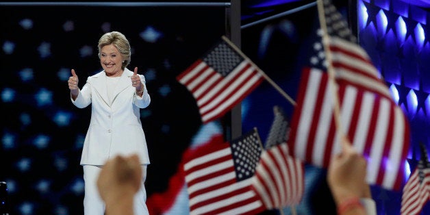 Democratic U.S. presidential nominee Hillary Clinton reacts as she arrives to accept the nomination on the fourth and final n