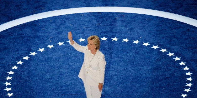 Democratic presidential nominee Hillary Clinton waives as she walks on stage to accept her nomination during the fourth and final night of the Democratic National Convention at Wells Fargo Center on July 28, 2016 in Philadelphia, Pennsylvania. / AFP / Patrick T. Fallon (Photo credit should read PATRICK T. FALLON/AFP/Getty Images)