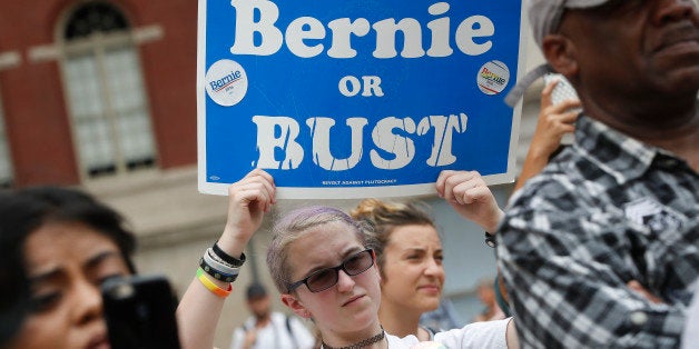 A supporter of Sen. Bernie Sanders, I-Vt., holds a "Bernie or BUST" sign at a rally in Philadelphia, Thursday, July 28, 2016,