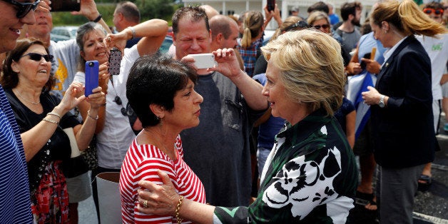 Democratic presidential nominee Hillary Clinton campaigns at Grandpa's Cheesebarn in Ashland, Ohio, U.S. July 31, 2016. REUT