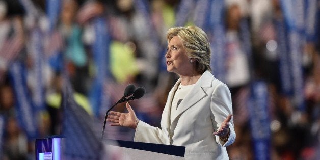 Democratic presidential nominee Hillary Clinton addresses delegates on the fourth and final night of the Democratic National Convention at Wells Fargo Center on July 28, 2016 in Philadelphia, Pennsylvania. / AFP / NICHOLAS KAMM (Photo credit should read NICHOLAS KAMM/AFP/Getty Images)