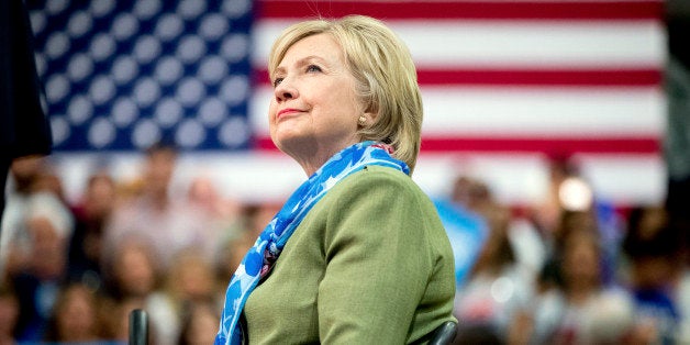 Democratic presidential candidate Hillary Clinton arrives to speak at a rally at Adams City High School in Commerce City, Col
