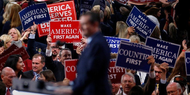 People wave placards during senator Ted Cruz's (R-TX) speech at the Republican National Convention in Cleveland, U.S., July 2