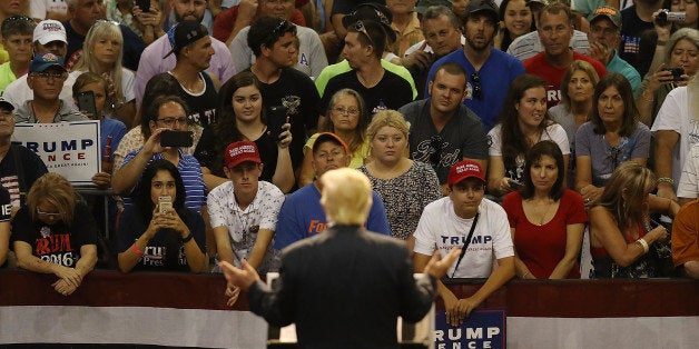 DAYTONA BEACH, FL - AUGUST 03: People listen as Republican presidential nominee Donald Trump speaks during his campaign event at the Ocean Center Convention Center on August 3, 2016 in Daytona, Florida. Trump continued to campaign for his run for president of the United States. (Photo by Joe Raedle/Getty Images)