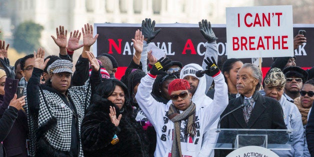 (L-R) Kadiatou Diallo, mother of Amadou Diallo; Sybrina Fulton, the mother of Trayvon Martin; Samaira Rice, the mother of Tamir Rice; Lesley McSpadden, the mother of Michael Brown Jr raise their hands during the 'Justice For All' march and rally in Washington with the Rev. Al Sharpton. Thousands of marchers descended on the nation's capital to demand justice for black men who have died at the hands of white police. Organized Sharpton's National Action Network, the march called for an end to racial profiling, police brutality, and lack of justice in state grand jury proceedings. (Photo by Brooks Kraft LLC/Corbis via Getty Images)