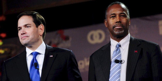 Republican U.S. presidential candidates Marco Rubio (L) and Ben Carson wait for the start of the Presidential Family Forum in Des Moines, U.S. November 20, 2015. REUTERS/Mark Kauzlarich/File Photo