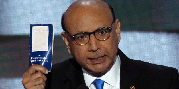 Khizr Khan, whose son, Humayun S. M. Khan was one of 14 American Muslims who died serving in the U.S. Army in the 10 years after the 9/11 attacks, offers to loan his copy of the Constitution to Republican U.S. presidential nominee Donald Trump, as he speaks during the last night of the Democratic National Convention in Philadelphia, Pennsylvania, U.S. July 28, 2016. REUTERS/Mike Segar