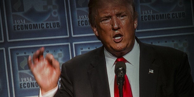 Donald Trump, 2016 Republican presidential nominee, speaks on a monitor during an event to discuss his economic plans at the Detroit Economic Club in Detroit, Michigan, U.S., on Monday, Aug. 8, 2016. Trump is promising the biggest overhaul to the personal income-tax code since Ronald Reagan, as well as a deep cut in the corporate tax rate. He's also pledging to end excessive regulation and lift restrictions on the nation's energy producers. Photographer: Sean Proctor/Bloomberg via Getty Images