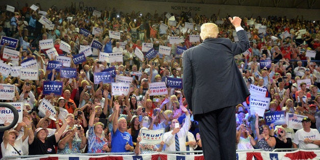Republican presidential candidate Donald Trump gives a thumbs up to the crowd as he takes the stage Tuesday, Aug. 9, 2016 at