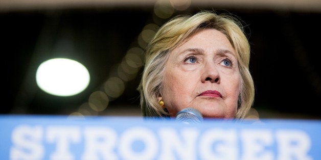 Democratic presidential candidate Hillary Clinton pauses while speaking at a rally at the Coliseum in St. Petersburg, Fla., M