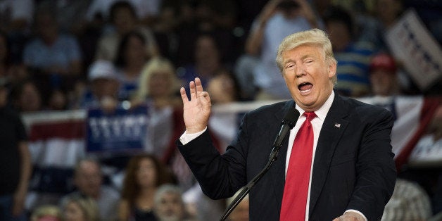 Donald Trump, 2016 Republican presidential nominee, speaks during a campaign rally at the Erie Insurance Arena in Erie, Pennsylvania, U.S., on Friday, Aug. 12, 2016. Two days after Trump said that President Barack Obama had founded Islamic State, and a day after he insisted that he meant what he said, the Republican presidential nominee reversed himself on Friday and claimed the statement was nothing more than sarcasm. Photographer: Ty Wright/Bloomberg via Getty Images