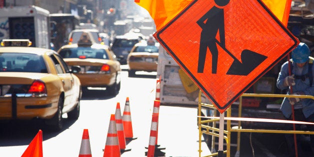 Traffic cones and sign on city street