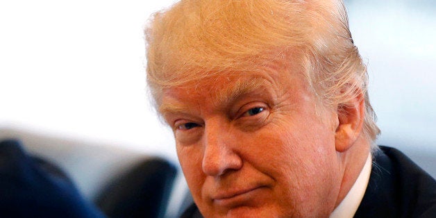 Republican presidential candidate Donald Trump smiles as he participates in a roundtable discussion on national security in his offices in Trump Tower in New York, Wednesday, Aug. 17, 2016. (AP Photo/Gerald Herbert)