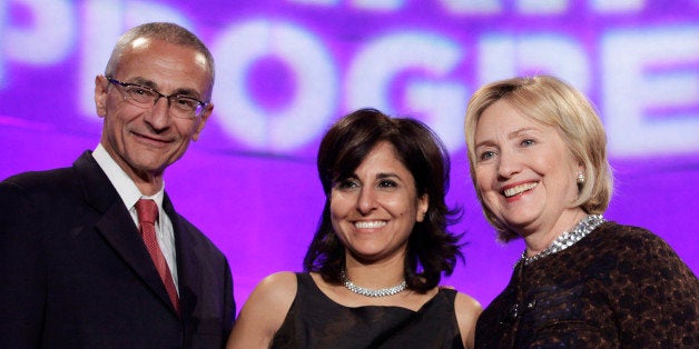 Former Secretary of State Hillary Clinton (R) poses with President of the Center for American Progress (CAP) Neera Tanden (C) and CAP founder and Chairman John Podesta at the 10th Anniversary policy forum in Washington, October 24, 2013. REUTERS/Yuri Gripas (UNITED STATES - Tags: POLITICS BUSINESS)