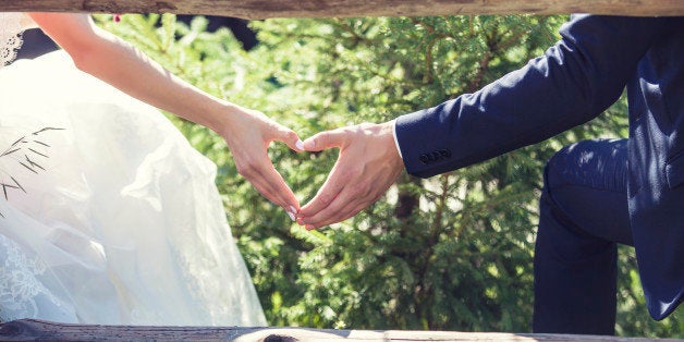 Man and woman couple holding hands on a romantic date or a wedding