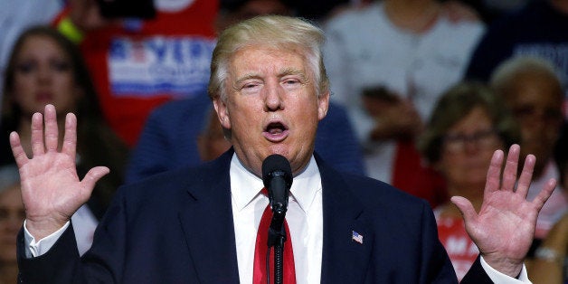 Republican presidential nominee Donald Trump speaks onstage during a campaign rally in Akron, Ohio, U.S., August 22, 2016. REUTERS/Carlo Allegri