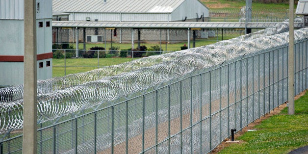 Fencing surrounds the Walnut Grove Correctional Facility in Walnut Grove, Mississippi, U.S., on Wednesday, April 17, 2013. In Mississippis four privately run prisons last year, the assault rate averaged three times as high as in state-run lockups. None was more violent than the Walnut Grove Youth Correctional Facility. Photographer: Daniel Acker/Bloomberg via Getty Images 