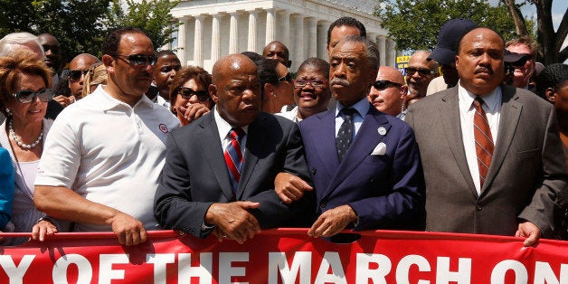 Rev. Al Sharpton (2nd R) links arms with Rep. John Lewis (D-GA) next to Martin Luther King III (R) as they begin to march during the 50th anniversary of the 1963 March on Washington for Jobs and Freedom at the Lincoln Memorial in Washington August 24, 2013. REUTERS/Kevin Lamarque (UNITED STATES - Tags: POLITICS ANNIVERSARY CIVIL UNREST)