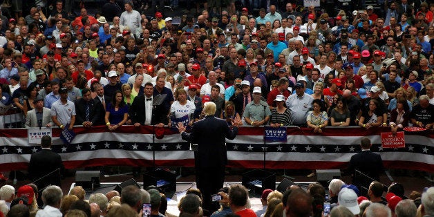 Republican presidential nominee Donald Trump speaks onstage during a campaign rally in Akron, Ohio, U.S., August 22, 2016. REUTERS/Carlo Allegri