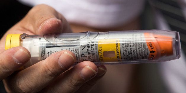 NEW YORK, NY - AUGUST 30: Timothy Lunceford Stevens, who suffers from autoimmune diseases and allergies, holds an EpiPen as he speaks to reporters during a protest against the price of EpiPens, outside the office of hedge fund manager John Paulson, August 30, 2016 in New York City. Paulson's hedge fund is a major investor in Mylan, the pharmaceutical company who has raised the price of EpiPens over 400 percent in the past 8 years. Mylan announced on Monday they will start offering a generic version of EpiPen, which will cost about half the price of the 600 dollar brand name version. (Photo by Drew Angerer/Getty Images)